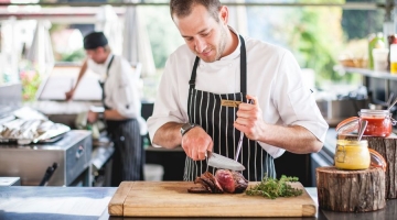 a man preparing food on a table