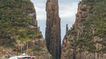 a group of people on a rock