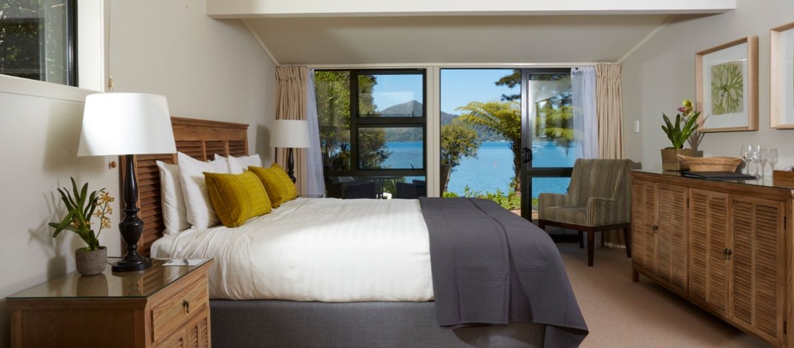 a bedroom with a large bed in a hotel room