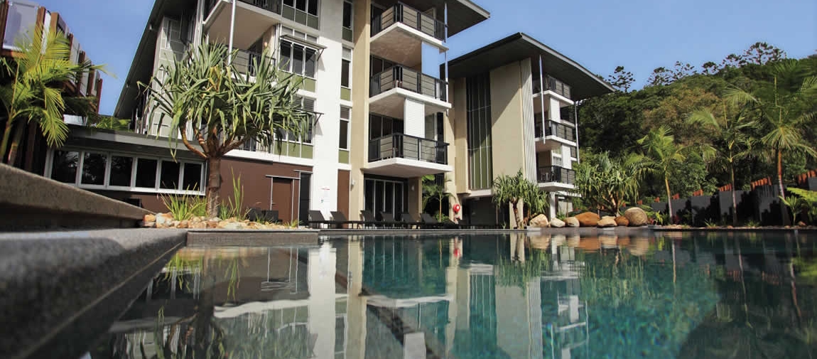 a house with a large pool of water