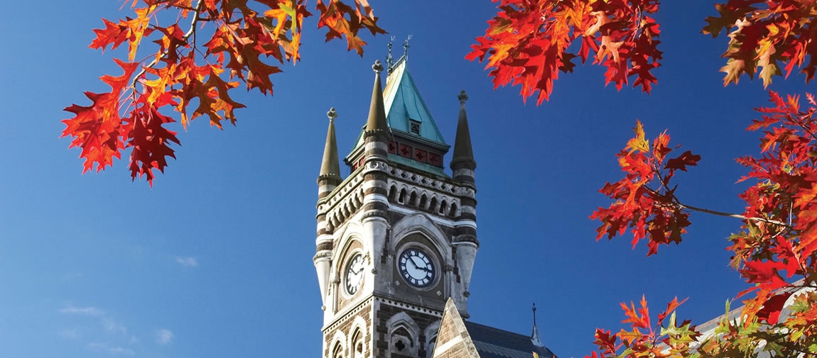 a large tall tower with a clock at the top of a building