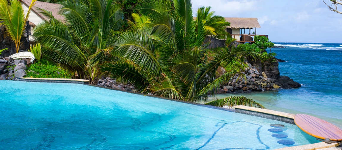 a pool next to a body of water