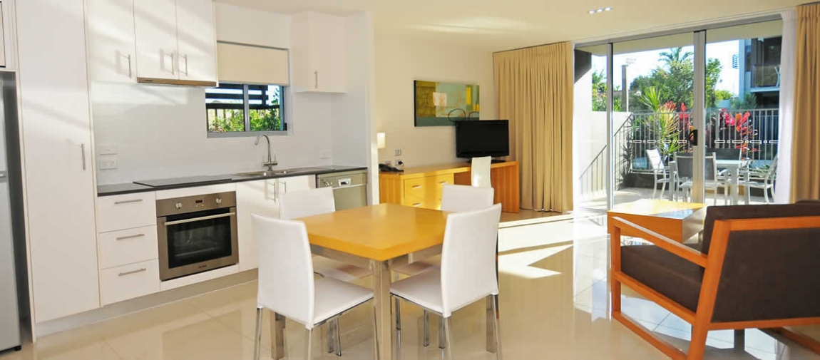 a kitchen with a dining room table