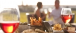 a plate of food and a glass of wine