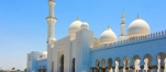 a group of people standing in front of Sheikh Zayed Mosque