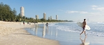 a group of people walking on a beach