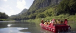 a person riding on the back of a boat in the water