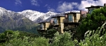 a house with a mountain in the background