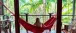 a person in a red chair in front of a window