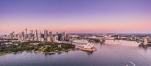 a body of water with a city in the background