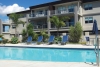 a blue pool of water in front of a building