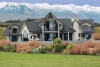 a house with a mountain in the background