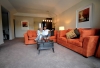 a large red chair in the living room