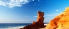 a group of people on a rocky beach