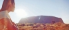 a person standing in front of a mountain