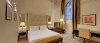 a bedroom with a bed in a hotel room
